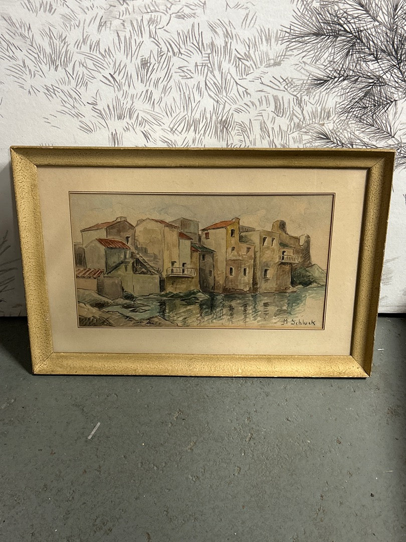 Aquarelle représentant des habitations signée M. Schluck