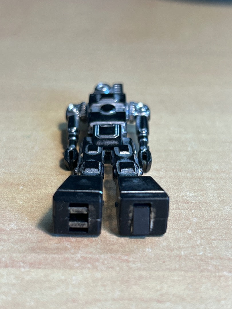 Figurine robot miniature vintage plastique argenté noir
