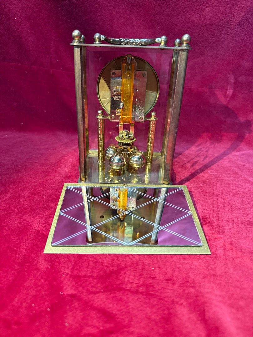 Pendule cage Haller mouvement mécanique bronze et verre
