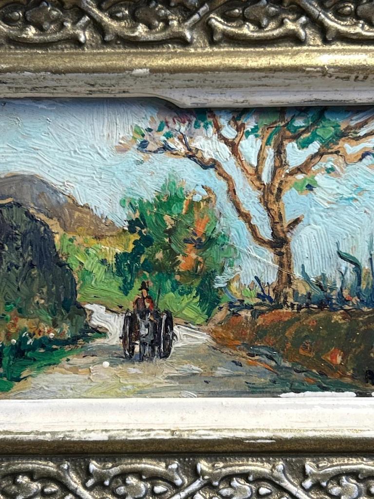 Ancien tableau représentant un paysage sur panneau signé Am
