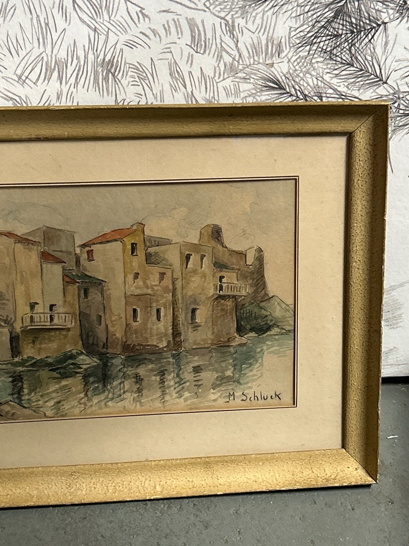 Aquarelle représentant des habitations signée M. Schluck