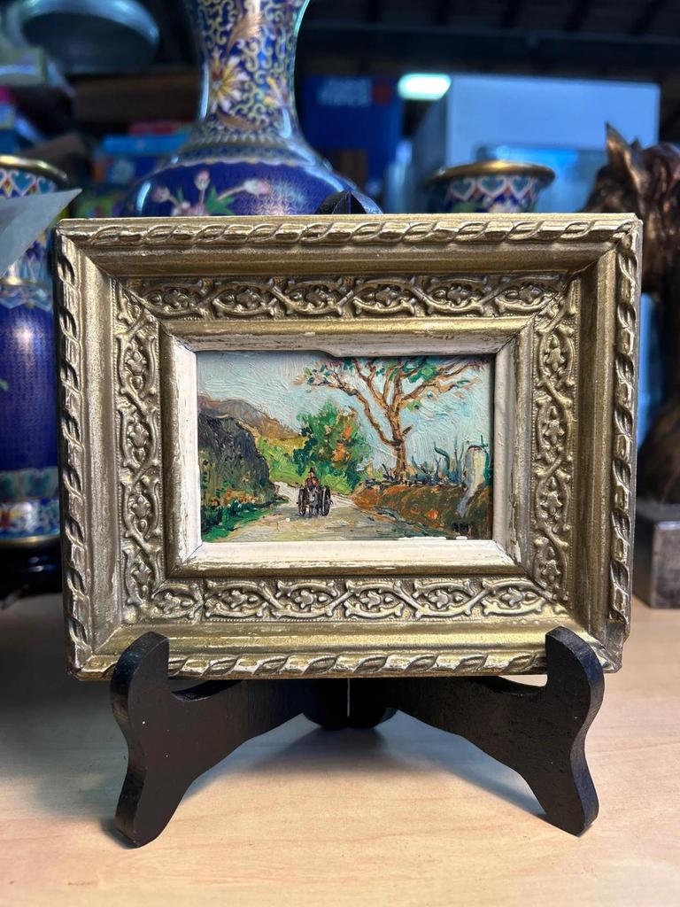 Ancien tableau représentant un paysage sur panneau signé Am