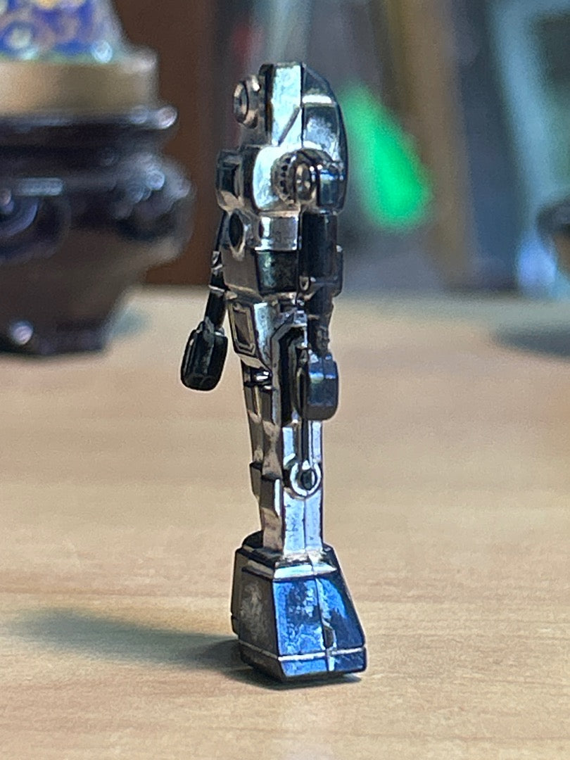 Figurine robot miniature vintage plastique argenté noir