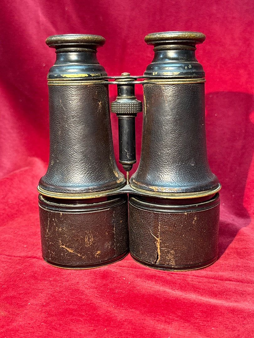 Jumelle marine ancienne en laiton gainée de cuir