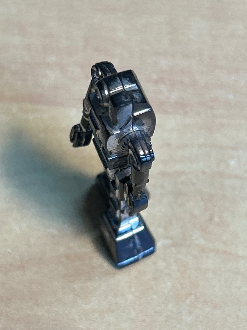 Figurine robot miniature vintage plastique argenté noir