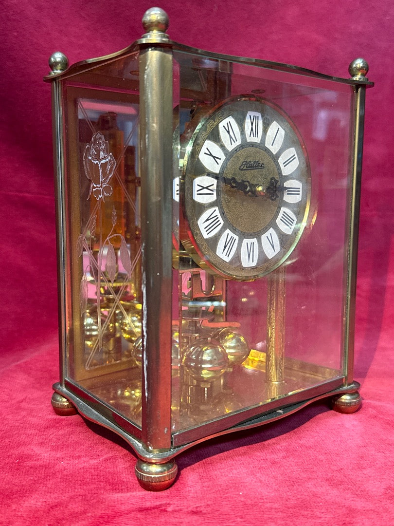 Pendule cage Haller mouvement mécanique bronze et verre
