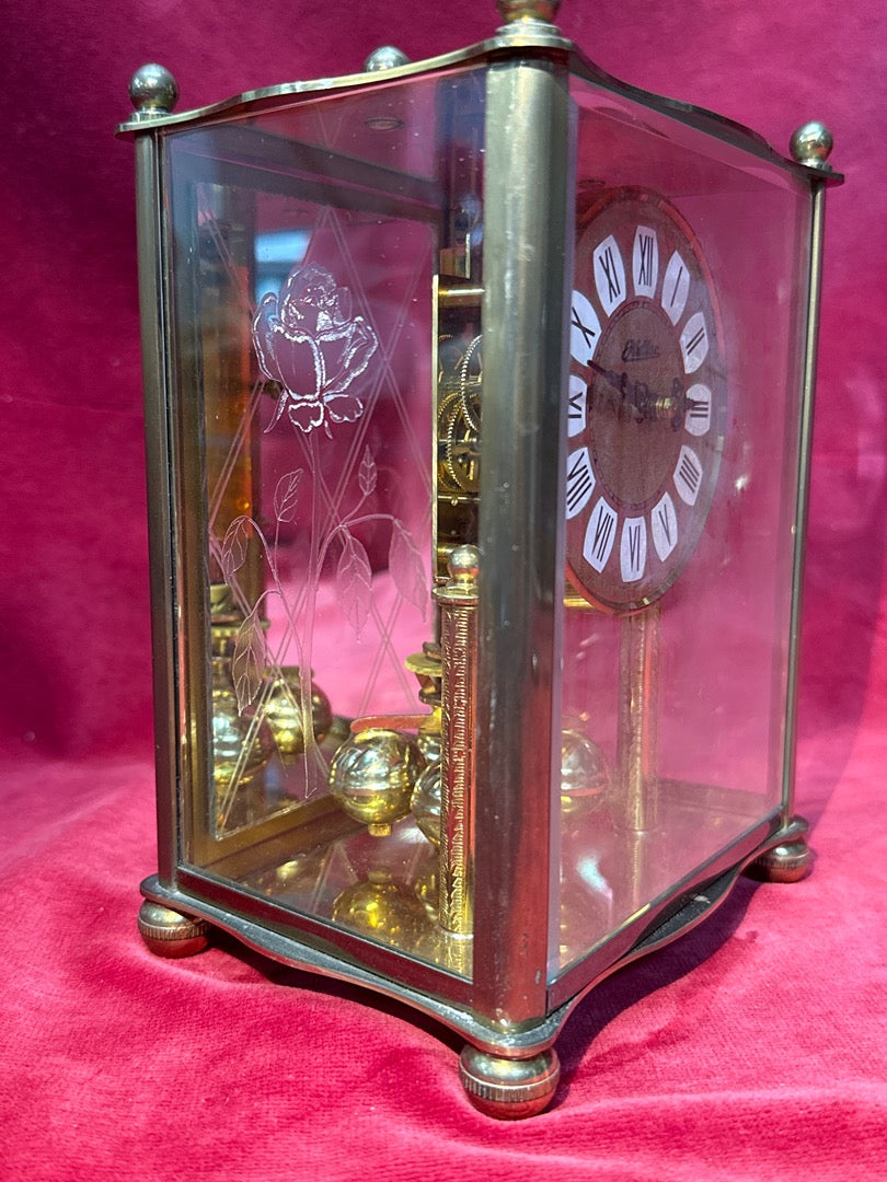 Pendule cage Haller mouvement mécanique bronze et verre