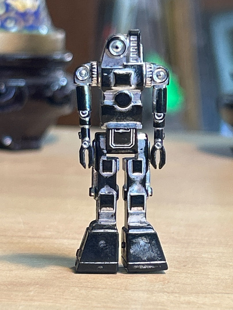 Figurine robot miniature vintage plastique argenté noir
